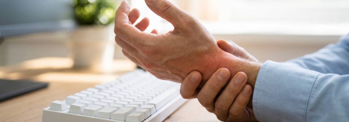 Man with wrist pain at office