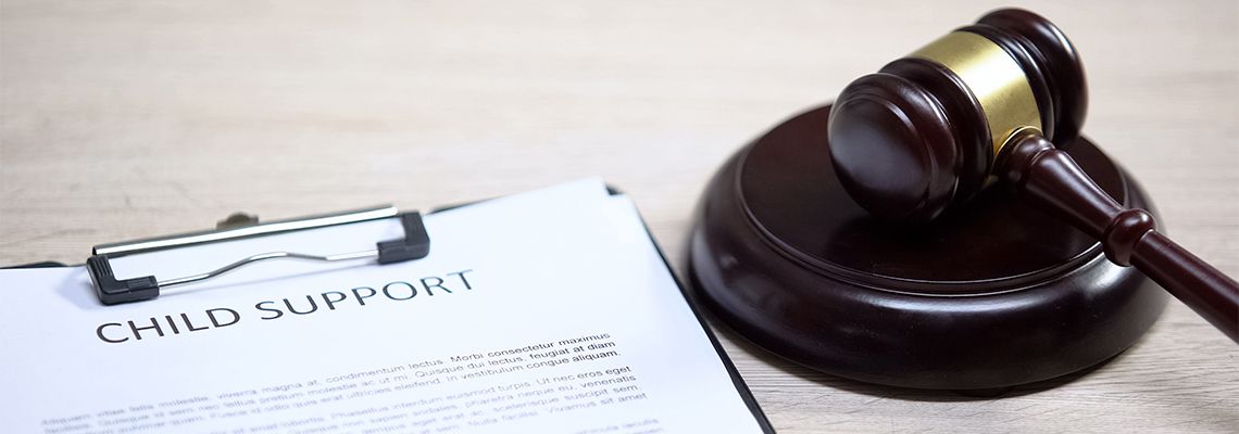 Child Support document and gavel in table
