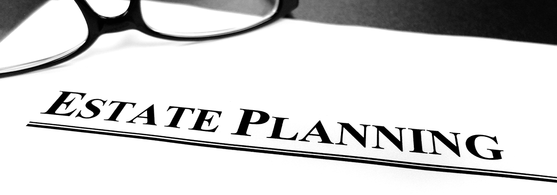 Estate Planning Documents on Desk with Glasses