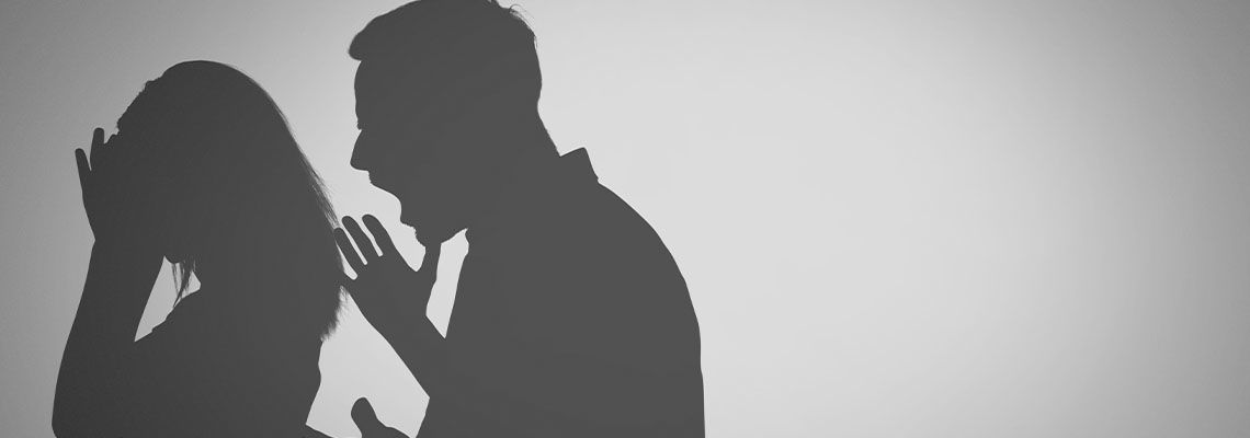 Silhouette of crying lady and shouting man