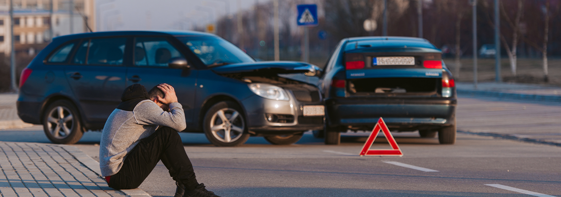 Desperate man after car wreck on the side of street