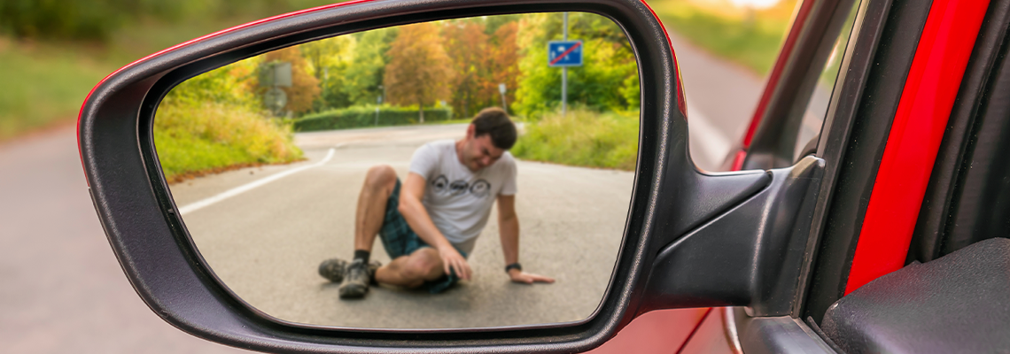 Rearview mirror with a man hit by a car