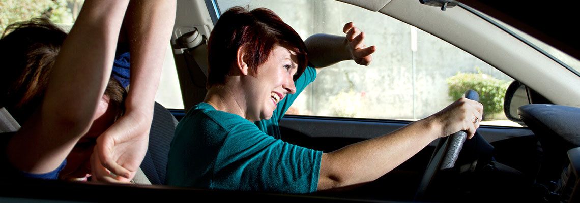 Driver and passenger bracing for car accident impact