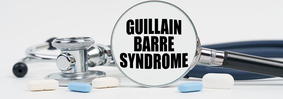 Guillain Barre Syndrome written inside magnifying glass, pills and stethoscope
