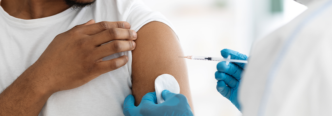 Cropped of black man receiving vaccine shot
