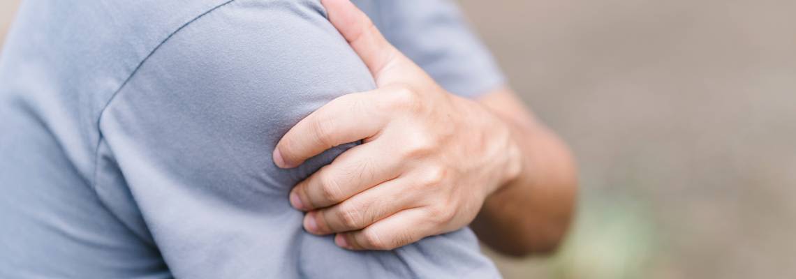 Man with sore arm after Vaccination