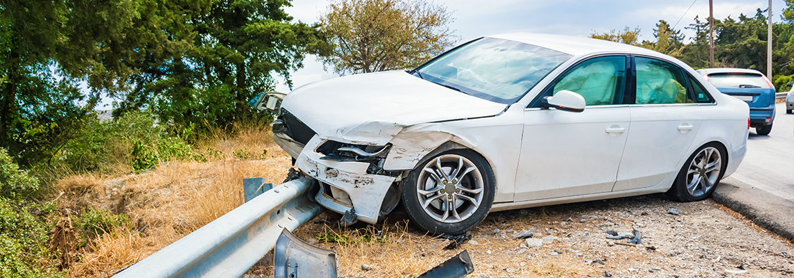 Crashed car with deflated airbags after accident on road