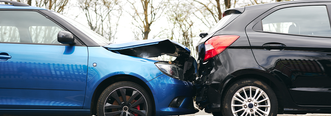 Two Damaged Cars Involved In Road Traffic Accident Showing Smoke After Collision