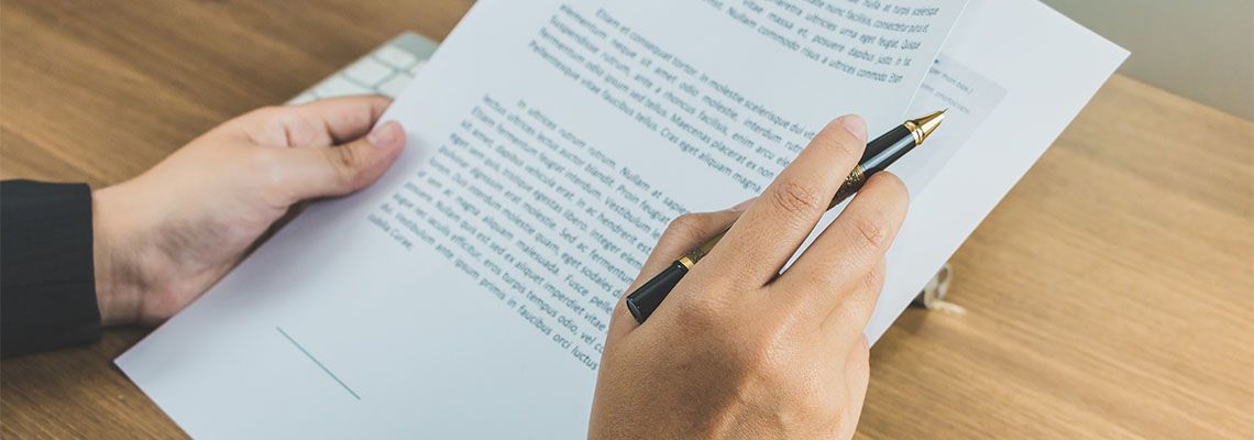 Women reading contract terms before signing
