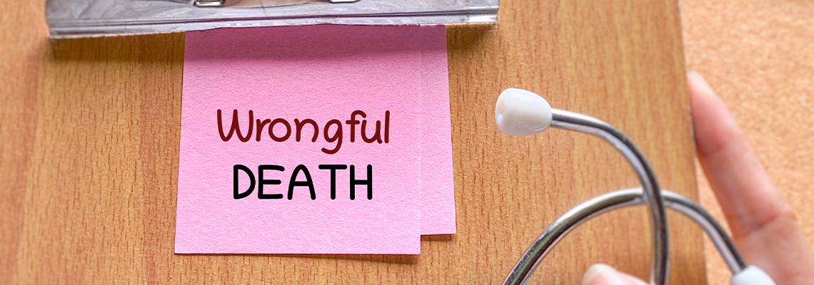 Clipboard with wrongful death note and stethoscope representing medical malpractice