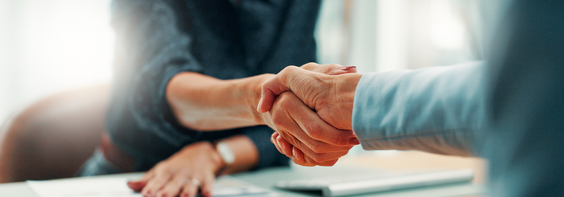 Handshake, deal and business people in office with agreement