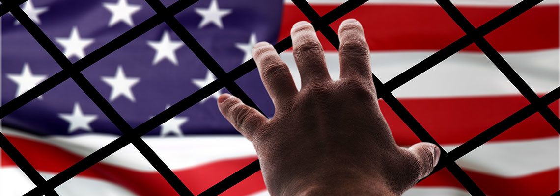 Bars in between hand and flag of America