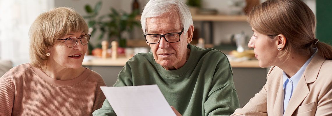 Senior couples discussing various estate planning options with attorney