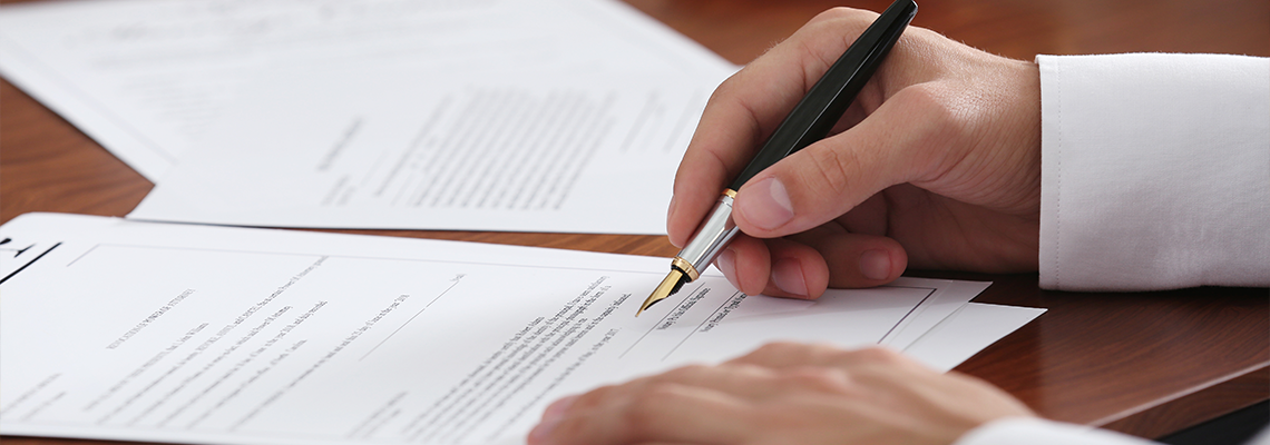 Notary public in office signing document