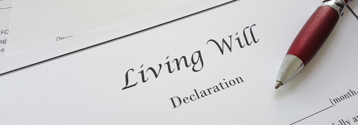 Power of Attorney and Living Will document and Pen on Table
