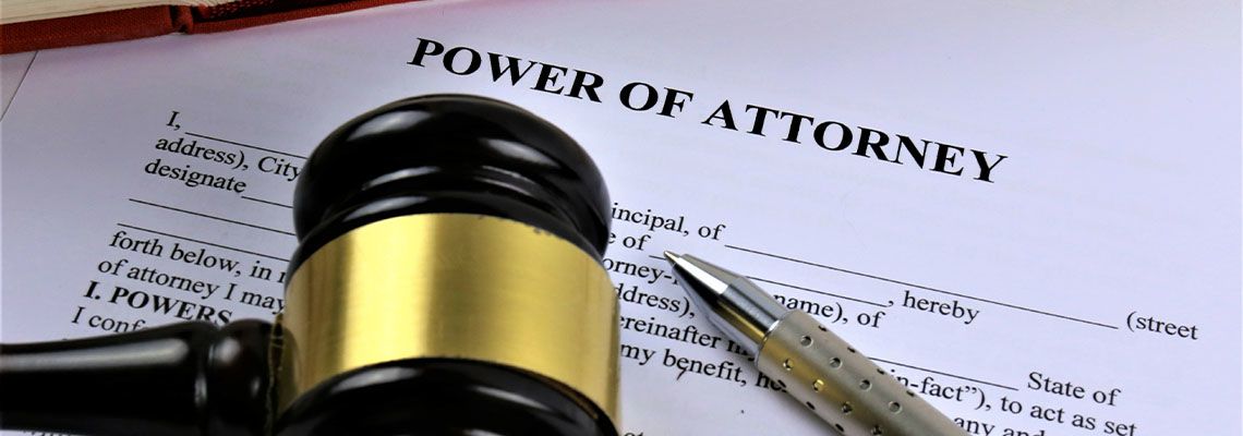 Power of Attorney file and gavel in table