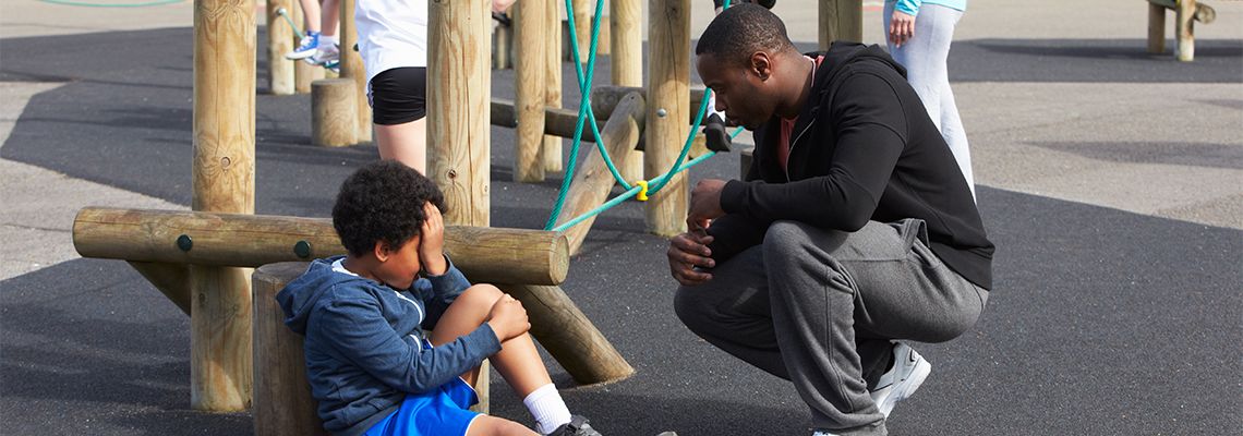 Injured kid cries in playground