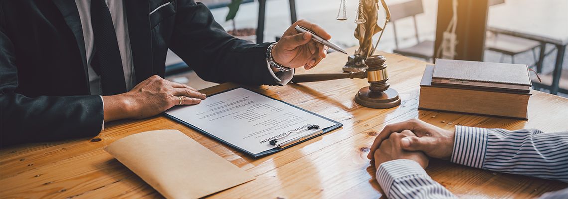 Attorney working with client in his office