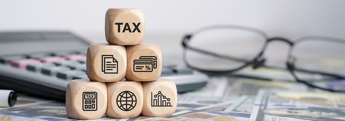 Word Tax on wooden cube with other related icons