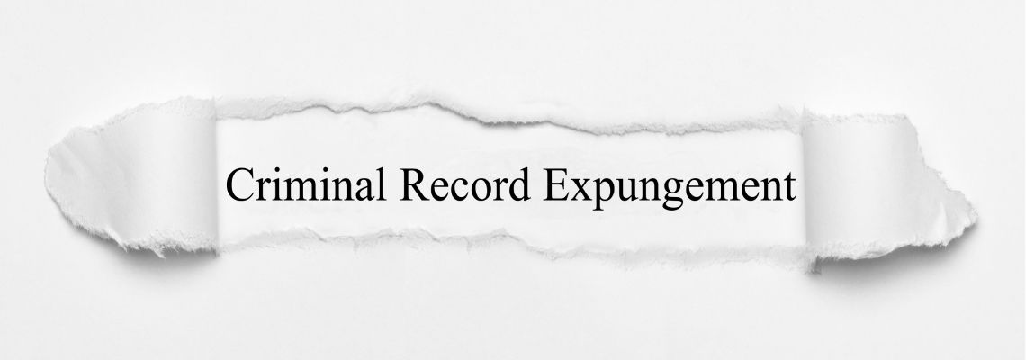 Criminal Record Expungement on white torn paper