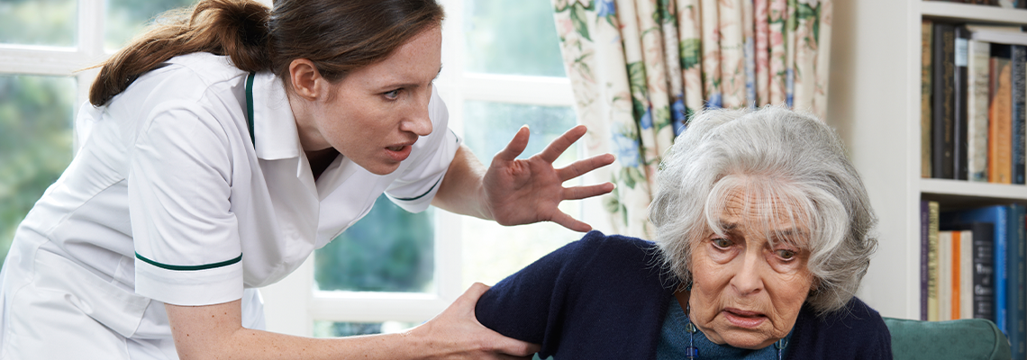Care Worker Mistreating Senior Woman At Home
