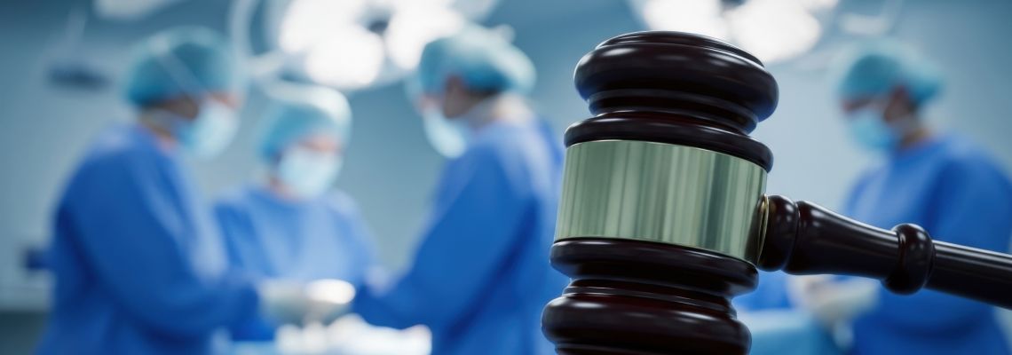 Gavel and Surgeons in surgery room