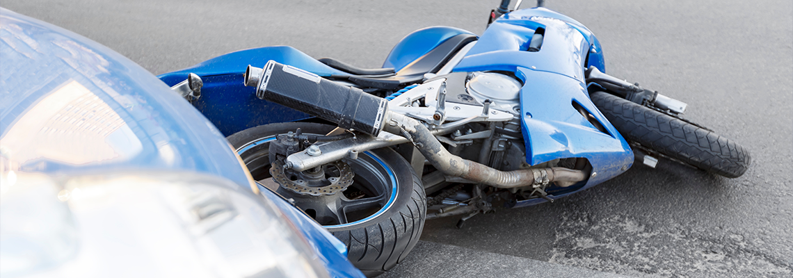 Accident motorcycle and cars on road