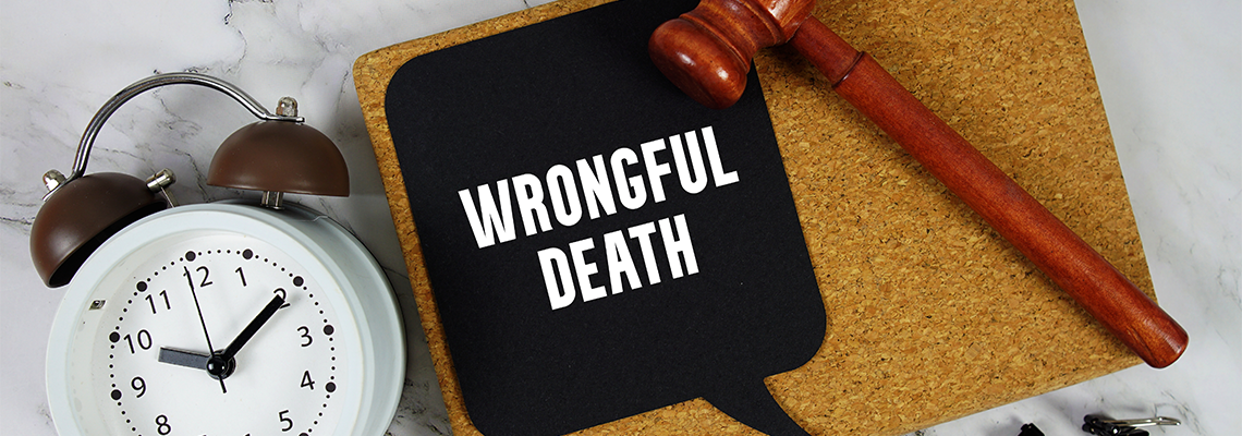 Wrongful Death text on speech bubble with alarm clock and wooden gavel