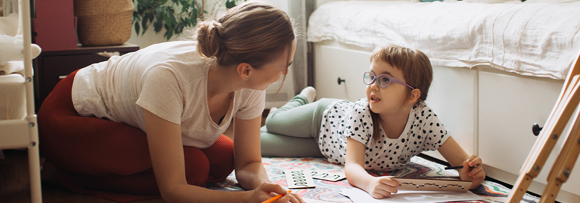 Mother and child learning together at home