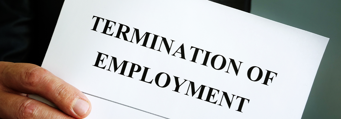 Man is holding Termination of employment papers