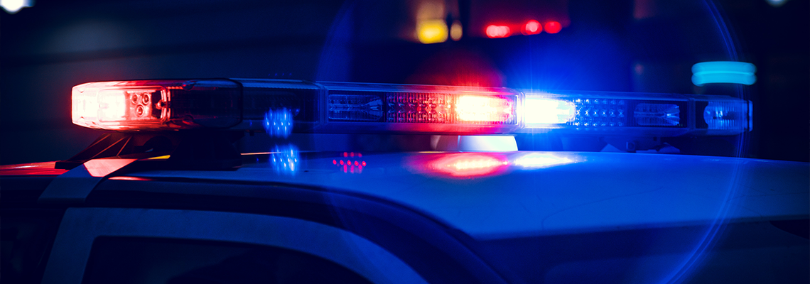 Closeup of Police Lights on Dark Street at Night