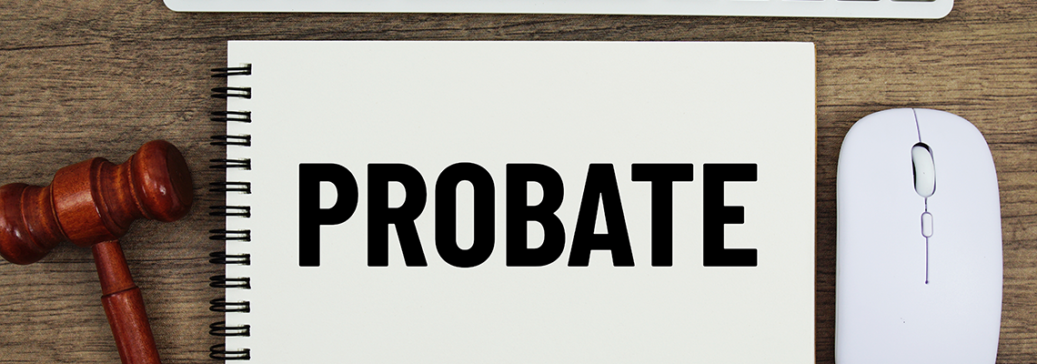 Probate text written on notepad with judge gavel, keyboard and optical mouse