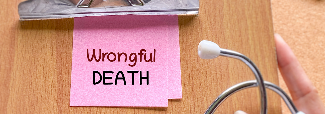 Clipboard with wrongful death note and stethoscope representing medical malpractice