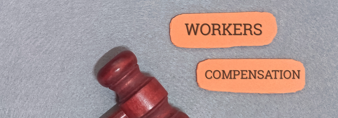 Wooden Gavel Symbolizing Legal Justice and Employee Rights with 'Workers Compensation' Labels,