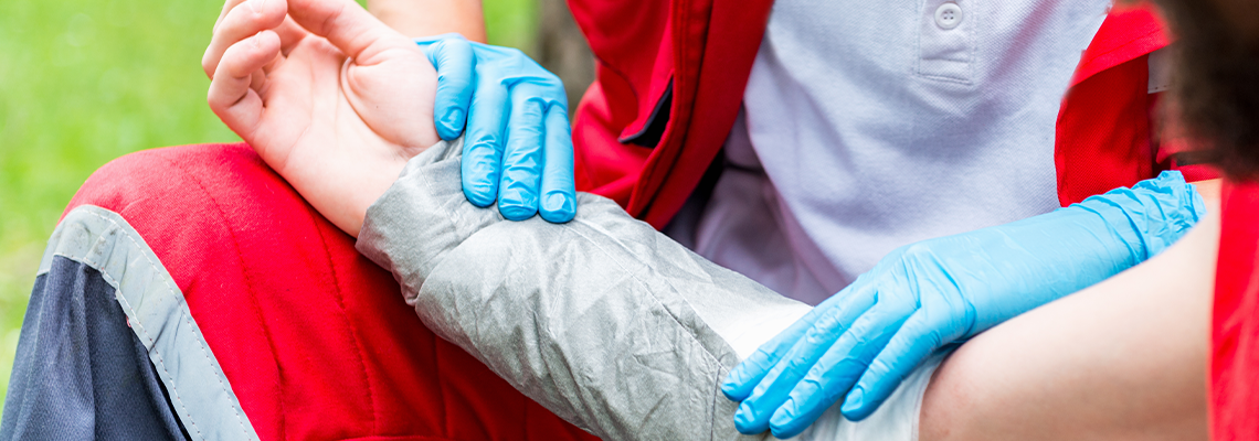 Paramedic placing bandage during training