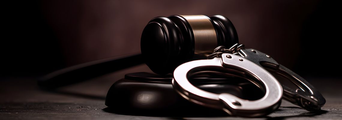 Gavel and Handcuff in table