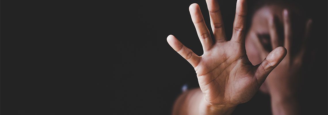 Women showing hands to stop domestic violence