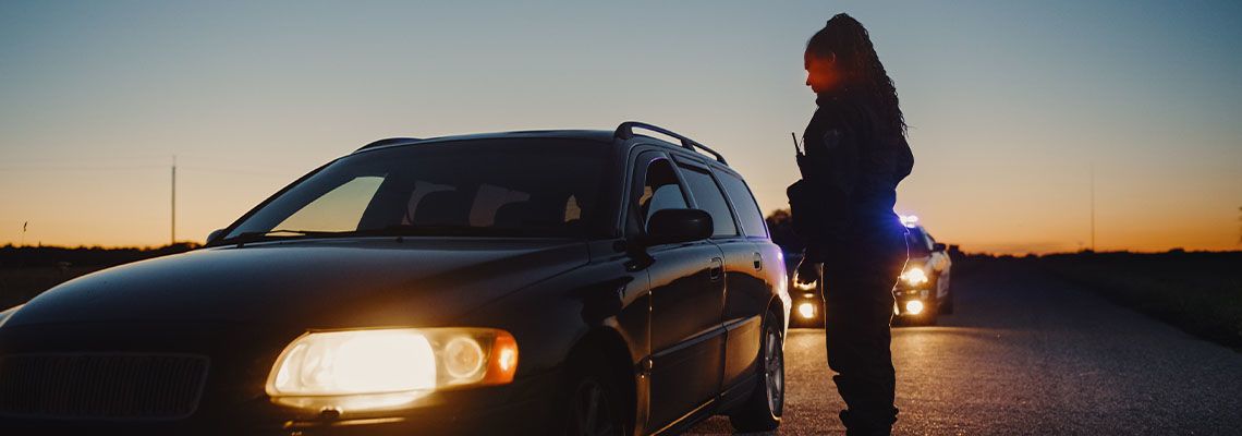 Police Officer stops car in highway