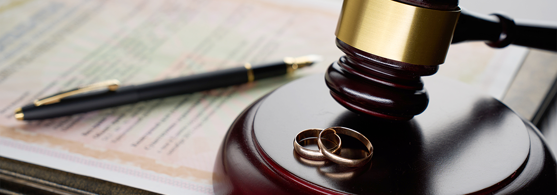Divorce decree or contract and gavel on table