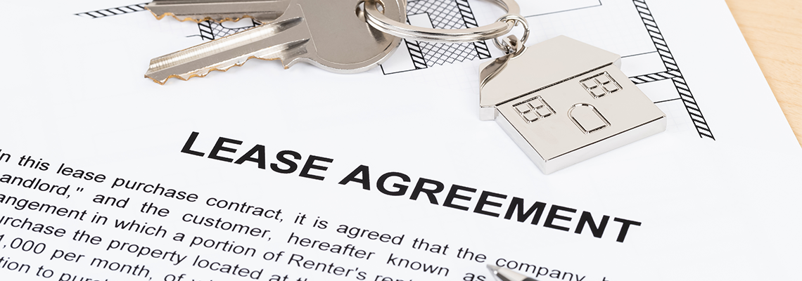 Rental agreement paperwork with house key