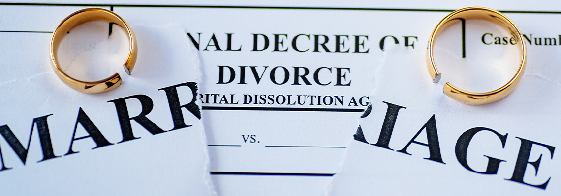 Divorce decree and two broken wedding rings