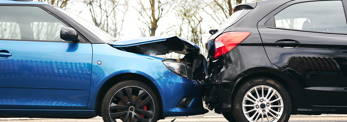 Two Damaged Cars Involved In Road Traffic Accident Showing Smoke After Collision