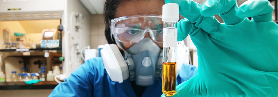 Man analyzing toxic liquids in laboratory