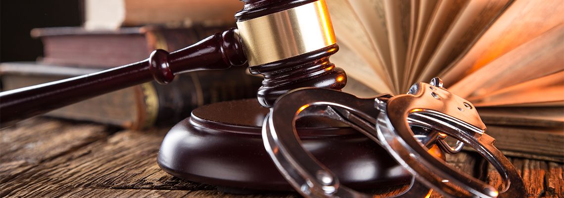 Gavel, handcuff and law book
