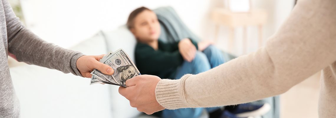 Man giving child support money to wife