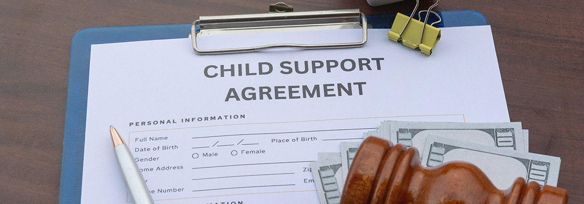 Child Support Payment and Legal Agreement Paper on Desk with Gavel