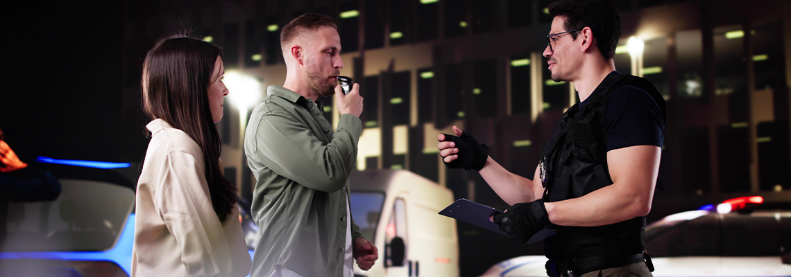 Police Officer Conducts Breath Test