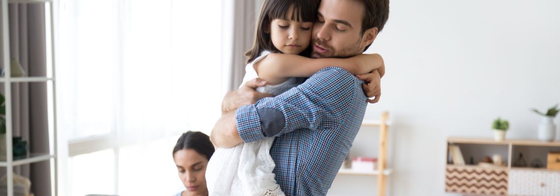 Little child hugging her dad