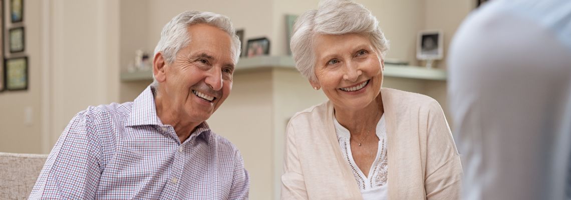 Senior couple consulting with attorney