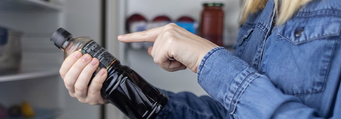 Woman reads instructions in product label